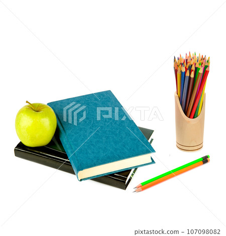 Books, apple and color pencils isolated on white background. 107098082