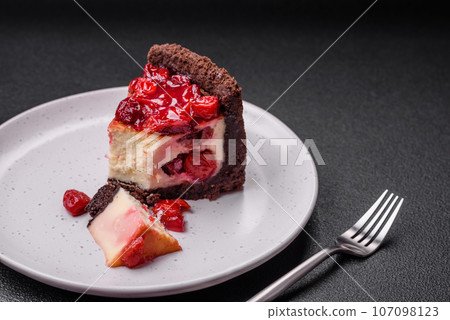 Delicious sweet cheesecake cake with mascarpone cheese, cherry berries and jam Delicious sweet cheesecake cake with mascarpone cheese, cherry berries and jam 107098123