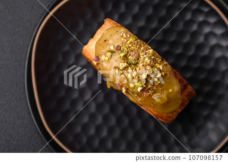 Round puff pastry croissant with raspberry filling or new york roll 107098157