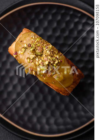 Round puff pastry croissant with raspberry filling or new york roll Round puff pastry croissant with raspberry filling or new york roll 107098158