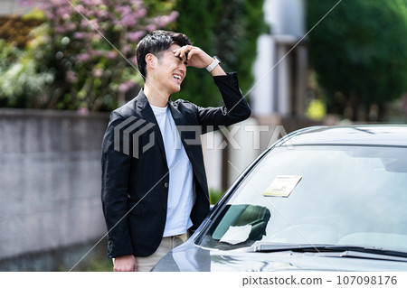 A car with a parking sticker 107098176