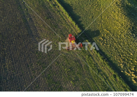 Harvester in Pampas Countryside, aerial view, La Pampa province, Argentina. Harvester in Pampas Countryside, aerial view, La Pampa province, Argentina. 107099474