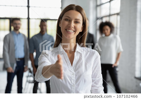 Caucasian businesswoman stretch hand greeting new employee Caucasian businesswoman stretch hand greeting new employee 107102466