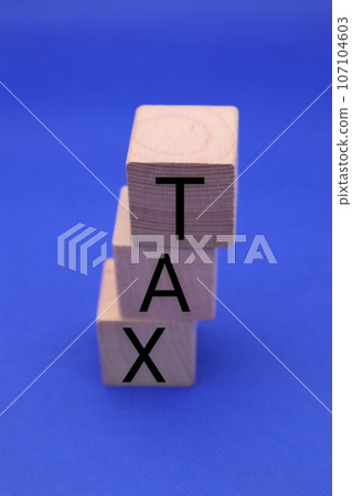 Building blocks with TAX written on them 107104603