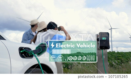 Modern family travel and nature with eco-friendly EV car concept. Peruse 107105265