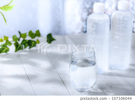 Plastic bottle and cup (by the window) Plastic bottle and cup (by the window) 107106044