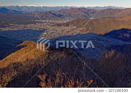 Morning view of the Southern Alps mountain range and Fujiyoshida/Kawaguchiko city from Mt. Morning view of the Southern Alps mountain range and Fujiyoshida/Kawaguchiko city from Mt. 107106300