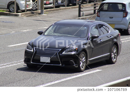 Sedan car road driving 107106789