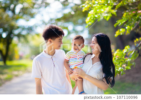 Family in summer park. Parents and kids outdoor. Family in summer park. Parents and kids outdoor. 107110096