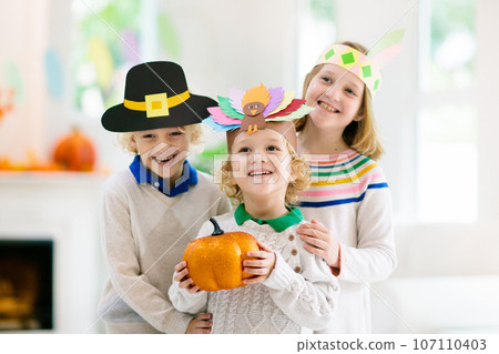 Child on Thanksgiving. Kid with autumn turkey hat. Child on Thanksgiving. Kid with autumn turkey hat. 107110403