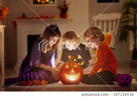 Kids in witch costume on Halloween trick or treat 107110516