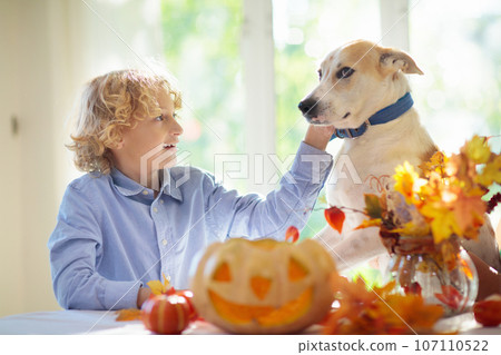Family carving pumpkin for Halloween 107110522