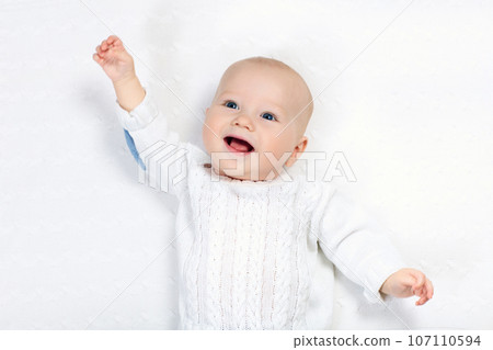 Baby boy on white blanket Baby boy on white blanket 107110594