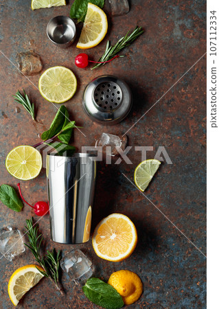 Ingredients for making cocktails on a rusty metal table. 107112334