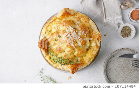 Baked cauliflower baked in puff pastry wit cheese . Delicious dish. Perfect tasty snack. top view, copy space Baked cauliflower baked in puff pastry wit cheese . Delicious dish. Perfect tasty snack. top view, copy space 107114494