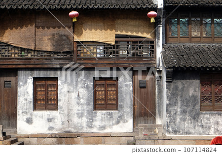 Traditional houses along the Grand Canal, ancient town of Yuehe in Jiaxing, Zhejiang Province, China Traditional houses along the Grand Canal, ancient town of Yuehe in Jiaxing, Zhejiang Province, China 107114824
