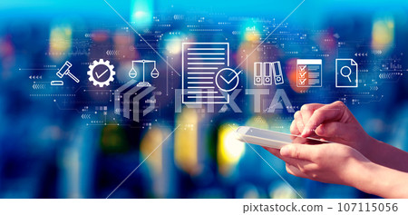 Compliance theme with person using a smartphone at night 107115056