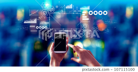 Digital Transformation concept with person using a smartphone at night 107115100