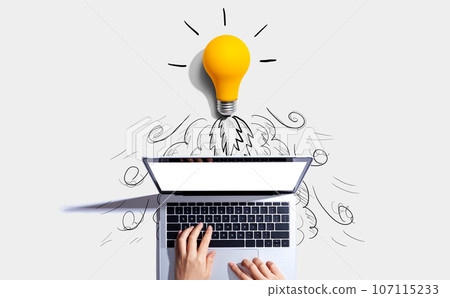 Idea light bulb flying to the sky like a rocket from a laptop computer 107115233