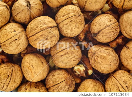 walnuts closeup background walnuts closeup background 107115684