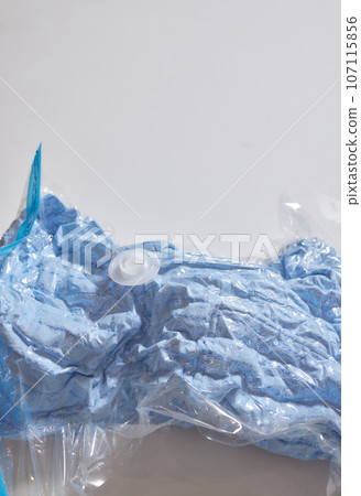 Space saver saving seal bag sucking air vacuum clothing storage compressed package. Space saver saving seal bag sucking air vacuum clothing storage compressed package. 107115856