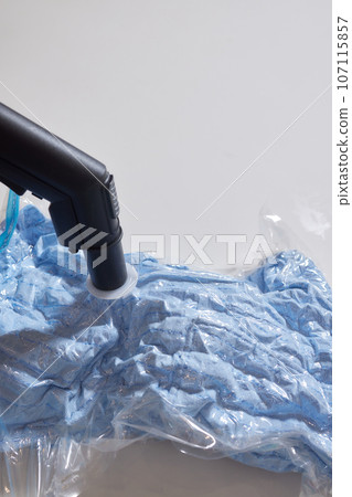 Space saver saving seal bag sucking air vacuum clothing storage compressed package. Space saver saving seal bag sucking air vacuum clothing storage compressed package. 107115857