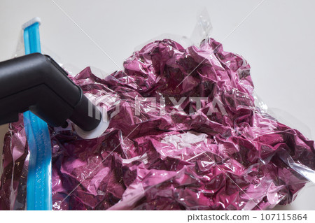 Space saver saving seal bag sucking air vacuum clothing storage compressed package. Space saver saving seal bag sucking air vacuum clothing storage compressed package. 107115864