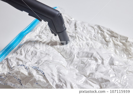 Space saver saving seal bag sucking air vacuum clothing storage compressed package. Space saver saving seal bag sucking air vacuum clothing storage compressed package. 107115939