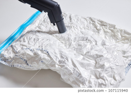 Space saver saving seal bag sucking air vacuum clothing storage compressed package. 107115940