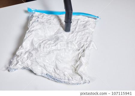 Space saver saving seal bag sucking air vacuum clothing storage compressed package. 107115941