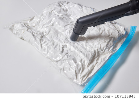 Space saver saving seal bag sucking air vacuum clothing storage compressed package. 107115945