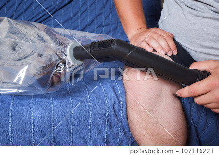 Space saver saving seal bag sucking air vacuum clothing storage compressed package. 107116221