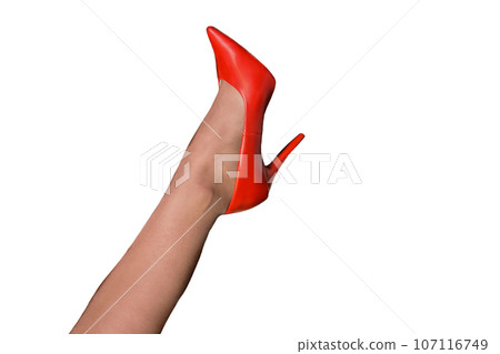 The foot of a person in red heels on white isolated background The foot of a person in red heels on white isolated background 107116749