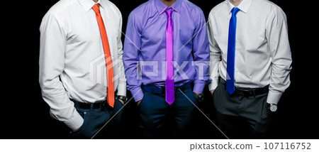 A group of men in business male style clothing fashion style different color shirts and tie on dark background 107116752