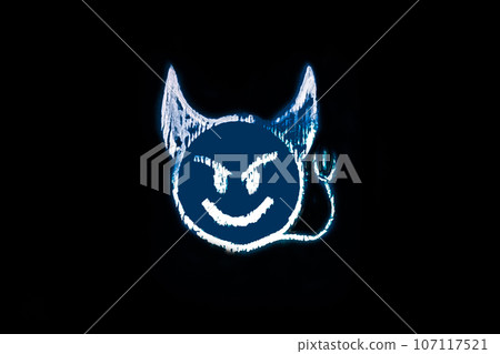 Devilish snide smiley smiley face drawn with crayon on the background black of a close-up 107117521