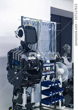 half-assembled humanoid robot in the process of assembly in the workshop half-assembled humanoid robot in the process of assembly in the workshop 107117615