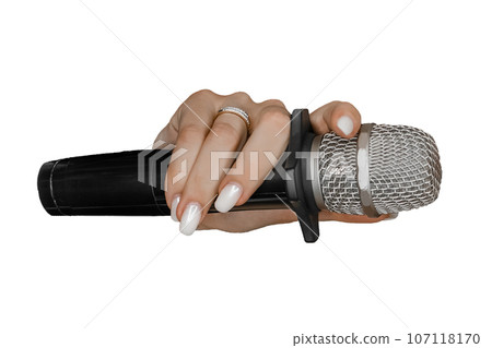 Hand of a young girl with a manicure and a ring holding a microphone on a white background, isolated Hand of a young girl with a manicure and a ring holding a microphone on a white background, isolated 107118170