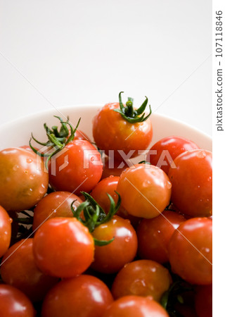 Fresh cherry tomatoes white background Fresh cherry tomatoes white background 107118846