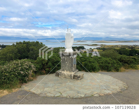 White statue of Saint Patrick at the start of foot path to the peak of Croagh Patrick, county Mayo, Ireland White statue of Saint Patrick at the start of foot path to the peak of Croagh Patrick, county Mayo, Ireland 107119028