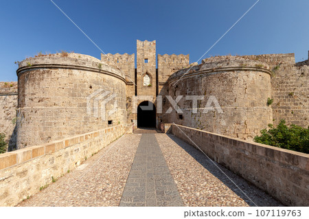 Stone towers and walls of old medieval fortifications on the Island of Rhodes. 107119763
