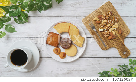 Coffee and sweets | Baumkuchen, financier, cookies and mixed nuts Coffee and sweets | Baumkuchen, financier, cookies and mixed nuts 107120057