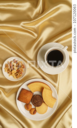 Coffee and sweets | Baumkuchen, financier, cookies and mixed nuts Coffee and sweets | Baumkuchen, financier, cookies and mixed nuts 107120063