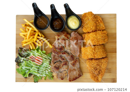 Top view of Dolly Fish Steak and French fries pork steak on the wood, focus selective 107120214