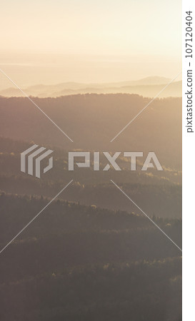 Morning mountains landscape. Sun lighting and haze. Carpathians. Ukraine. Morning mountains landscape. Sun lighting and haze. Carpathians. Ukraine. 107120404