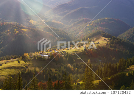 Majestic panorama of autumn mountains morning lighting with sun rays. Nature of Ukraine. Majestic panorama of autumn mountains morning lighting with sun rays. Nature of Ukraine. 107120422