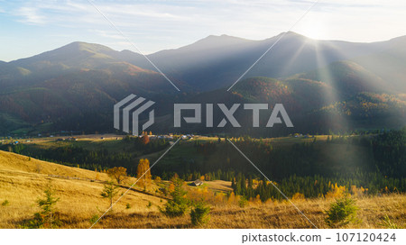 Majestic panorama of autumn mountains morning lighting with sun rays. Nature of Ukraine. Majestic panorama of autumn mountains morning lighting with sun rays. Nature of Ukraine. 107120424