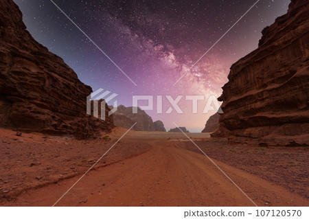 Wadi Rum desert, Jordan, The Valley of the Moon. Orange sand, Milky Way sky. Wadi Rum desert, Jordan, The Valley of the Moon. Orange sand, Milky Way sky. 107120570