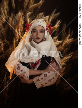 Woman as motanka . Traditional costume. Symbolism, ancient magic, force of nature, cosplay 107120901