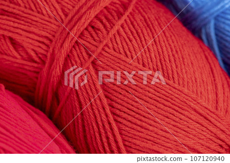 woolen threads of red color for knitting knitting close-up woolen threads of red color for knitting knitting close-up 107120940