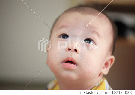 Cute Asian baby looking up Cute Asian baby looking up 107121028